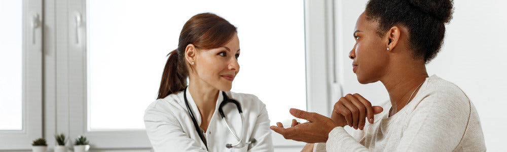 woman discussing breast eczema with her doctor